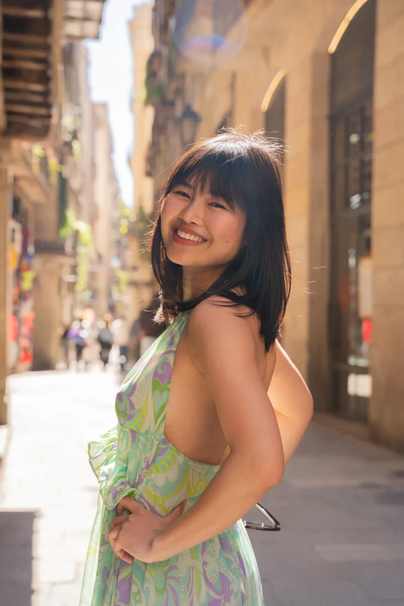Mai-Lan Khong, smiling, in a sunny street in Spain